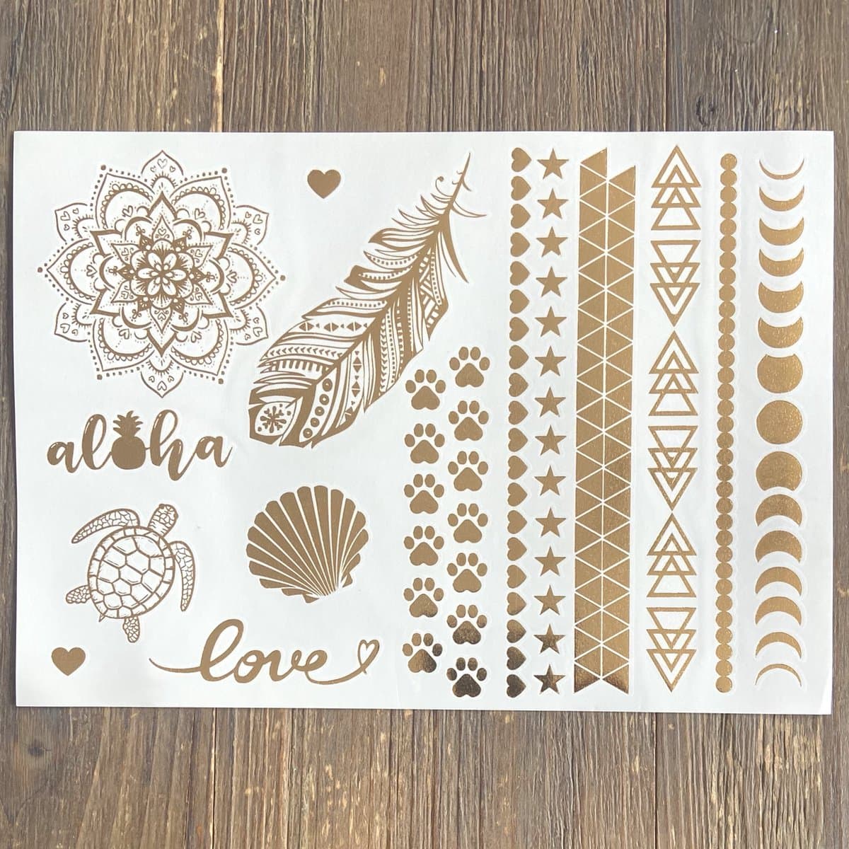 GetGlitterBaby® - Gouden Festival Plak Tattoos / Tijdelijke Flash Tattoo / Nep Tatoeage Metallic Goud / Festival Tattoes / Temporary Face Body Glitter Tattoo Sticker - Aloha