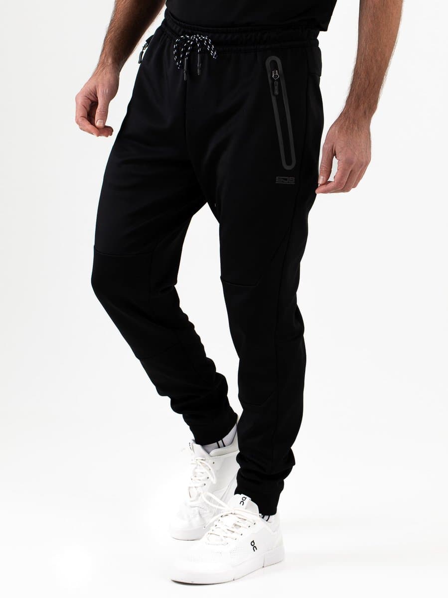 Sjeng Sports OMIKRON - Trainingsbroek Heren Zwart Powerstretch Bewegingsvrijheid Knieholte Ritsen Tailleband Tennis Fitness Sneldrogend